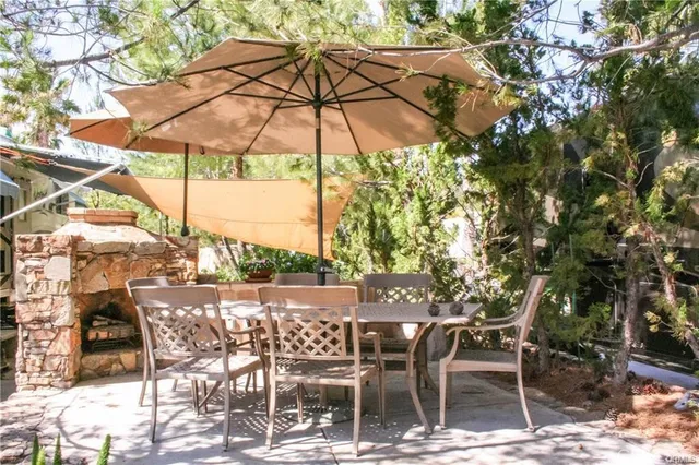 a view of a chairs and table in the patio
