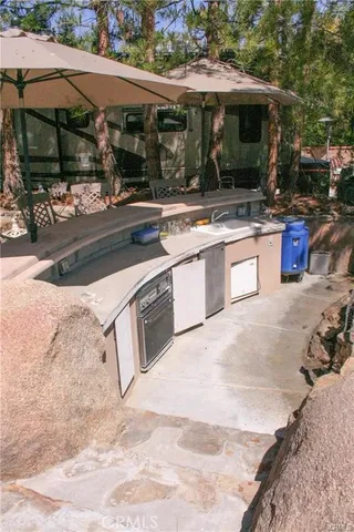 a outdoor view of a house with a yard and sitting area