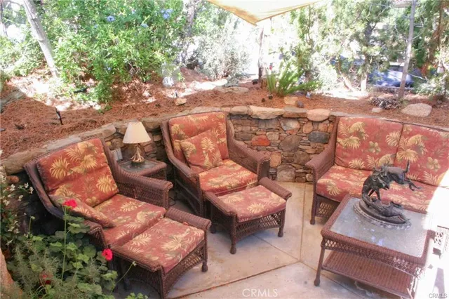 a backyard of a house with outdoor seating