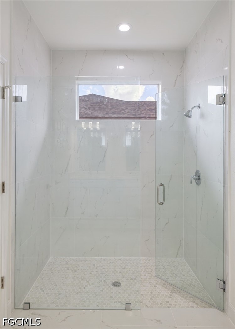 3000 3rd Street Southwest Lehigh Acres, FL 33976 - Photo 17 of 24 a bathroom with a shower