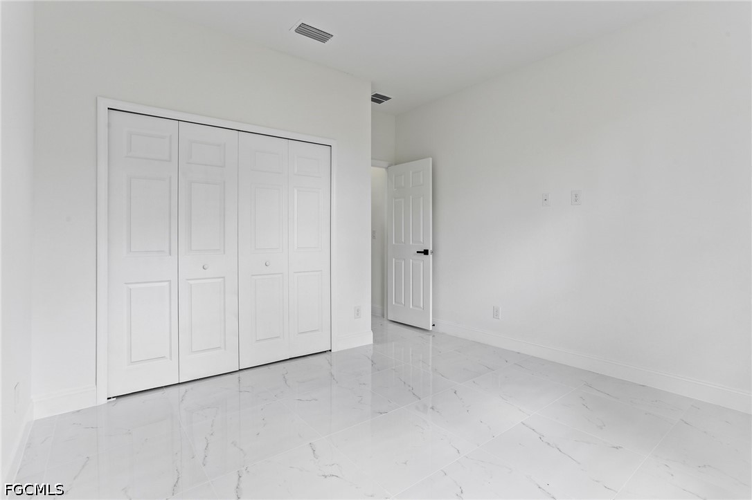 3000 3rd Street Southwest Lehigh Acres, FL 33976 - Photo 22 of 24 a view of an empty room