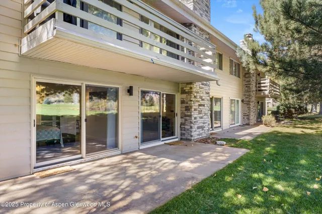 a view of a building with a backyard