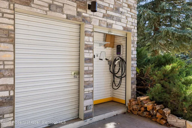 a bathroom with a shower and a sink