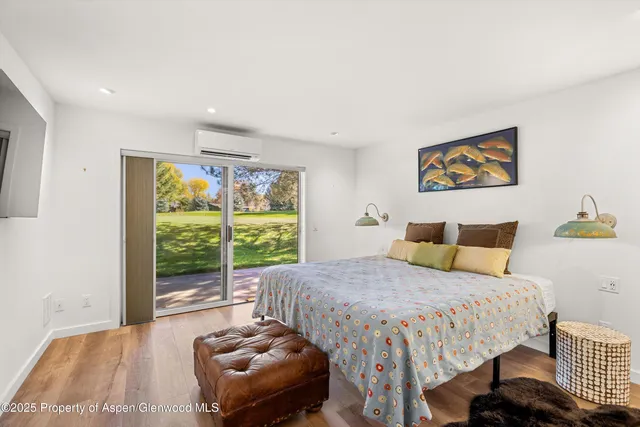 a bedroom with a bed and a couch