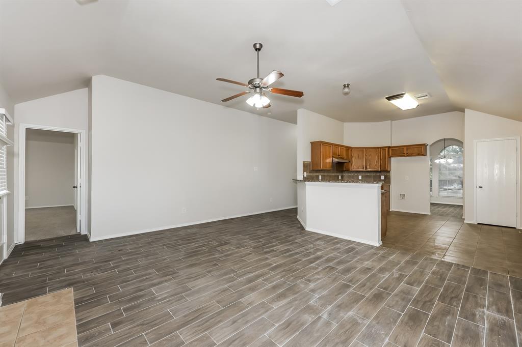 2926 Cowboy Drive Dallas, TX 75237 - Photo 4 of 16 a view of a kitchen with a stove cabinets and wooden floor