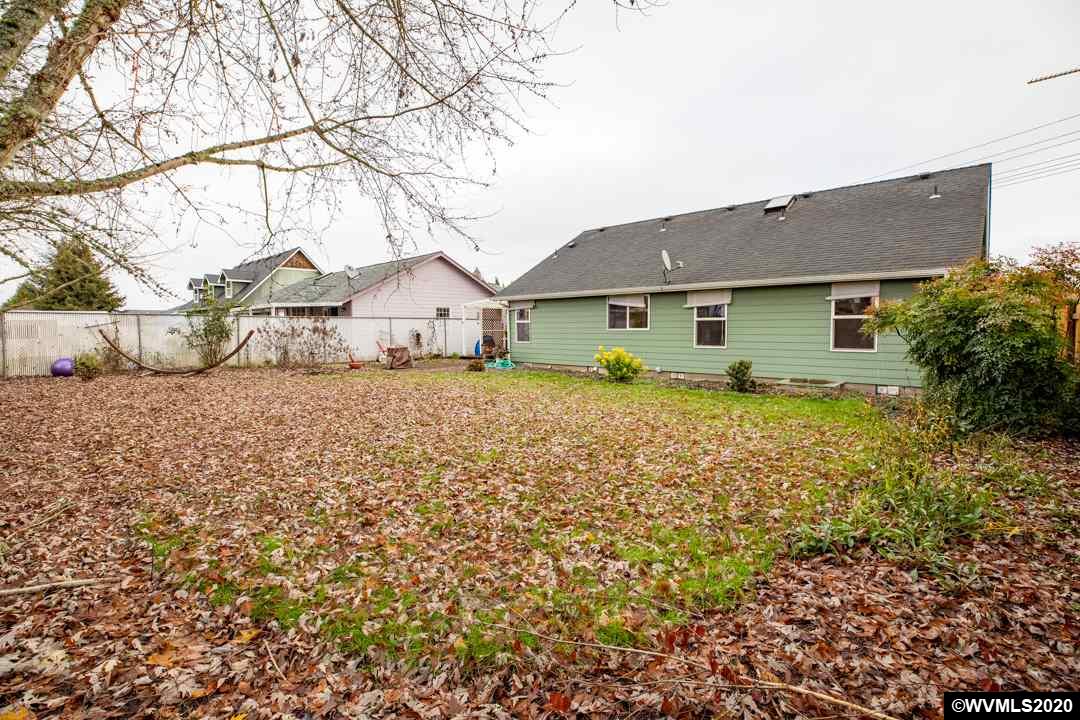 244 Edwards Road South Monmouth, OR 97361 - Photo 25 of 29 a view of a house with a large tree and a yard