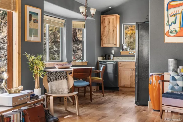 a dining room with furniture and window