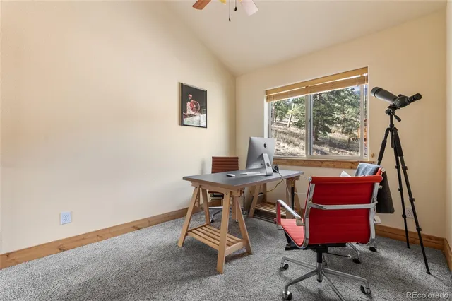 a view of a workspace with furniture