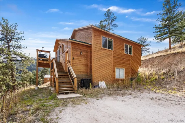 a front view of a house with stairs