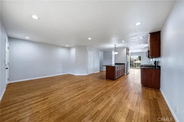 a view of kitchen and kitchen with a sink