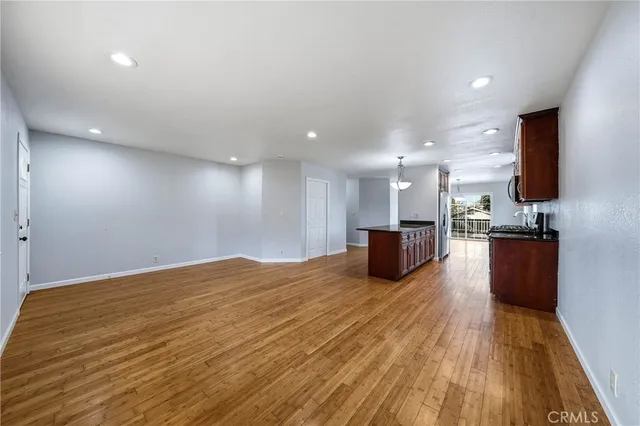 a view of kitchen and kitchen with a sink
