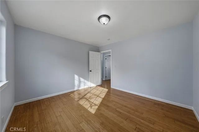 a bathroom with a sink a toilet a mirror and shower