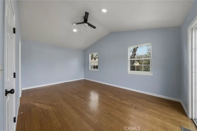 a bathroom with bathtub and window