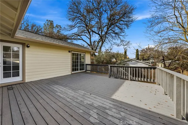 a view of a house with a wooden deck