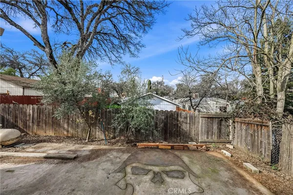 an aerial view of residential house and sandy dunes