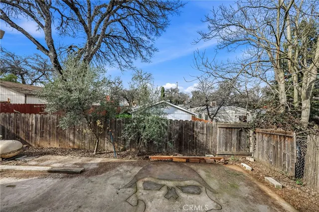 an aerial view of residential house and sandy dunes