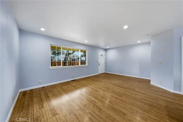 a view of kitchen with kitchen island microwave and stove