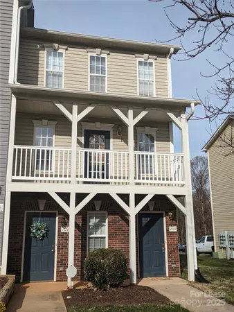 a front view of a house with parking