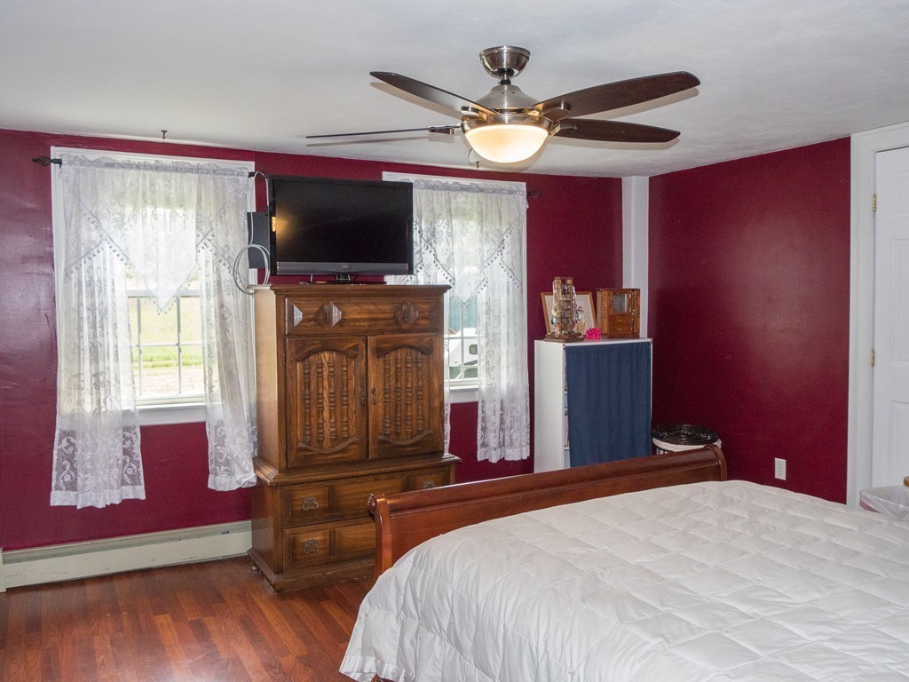 32 Old County Road Southampton, MA 01073 - Photo 12 of 23 a bedroom with a bed and a flat screen tv