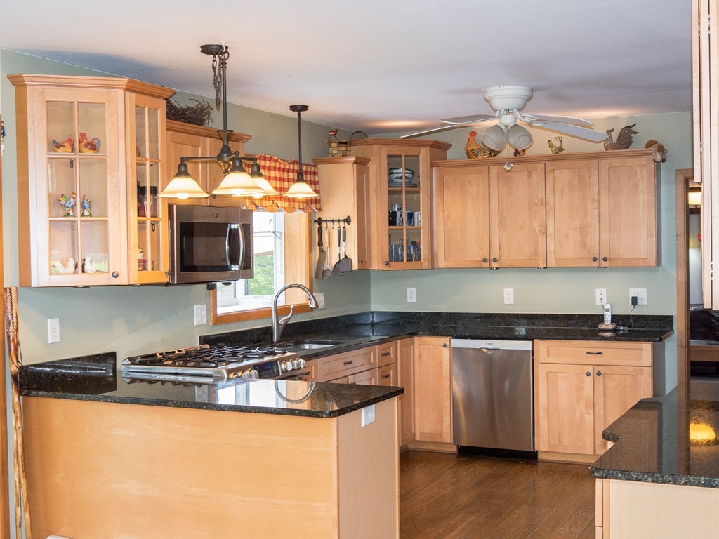 32 Old County Road Southampton, MA 01073 - Photo 17 of 23 a kitchen with granite countertop a sink a counter top space cabinets and stainless steel appliances