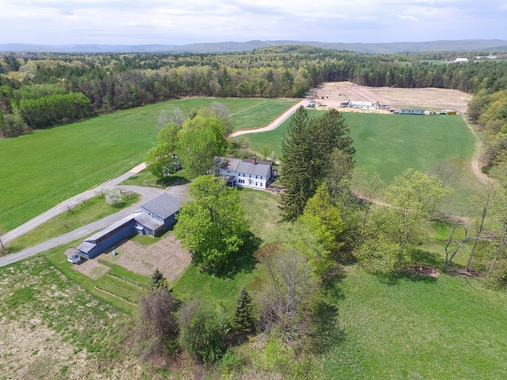 32 Old County Road Southampton, MA 01073 - Photo 5 of 23 a view of a lush green outdoor space with a lake view