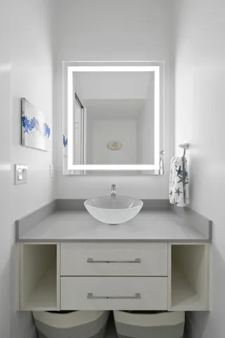 a bedroom with a large bed and a flat screen tv