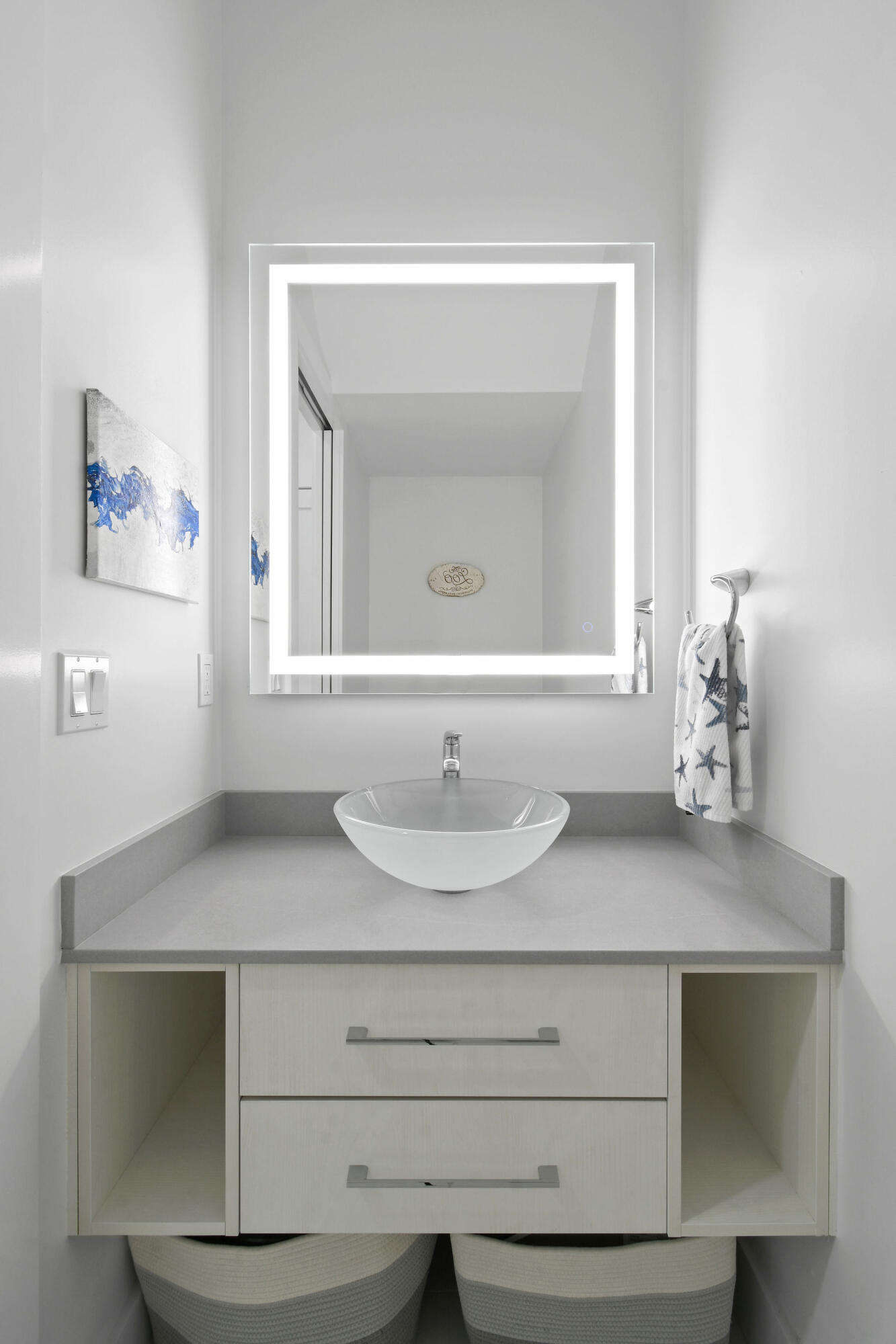 4707 Southeast Manatee Terrace Stuart, FL 34997 - Photo 13 of 68 a bathroom with a sink and a mirror