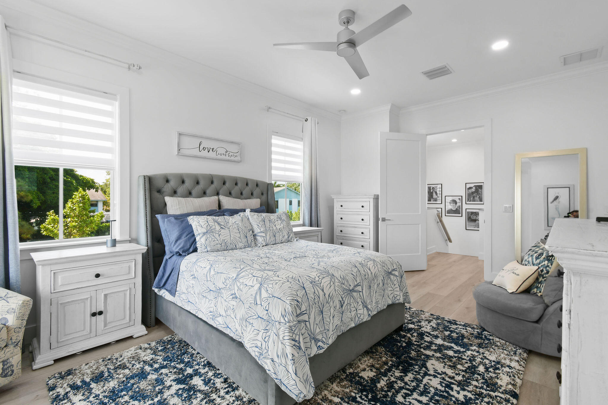 4707 Southeast Manatee Terrace Stuart, FL 34997 - Photo 20 of 68 a bedroom with a large bed and a window