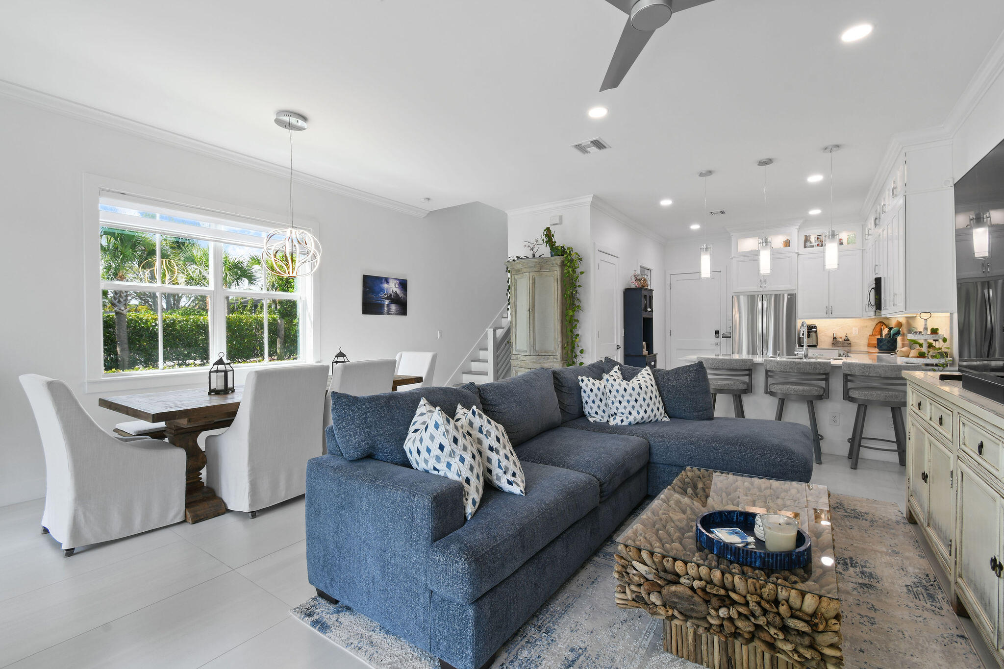 4707 Southeast Manatee Terrace Stuart, FL 34997 - Photo 2 of 68 a living room with furniture and a large window