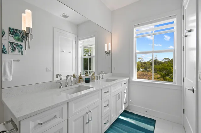 a view of a lake with houses in the back