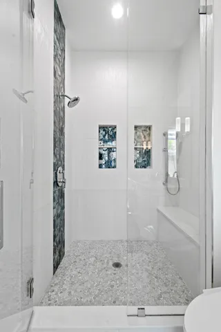 a view of a balcony with chair and floor to ceiling window yard