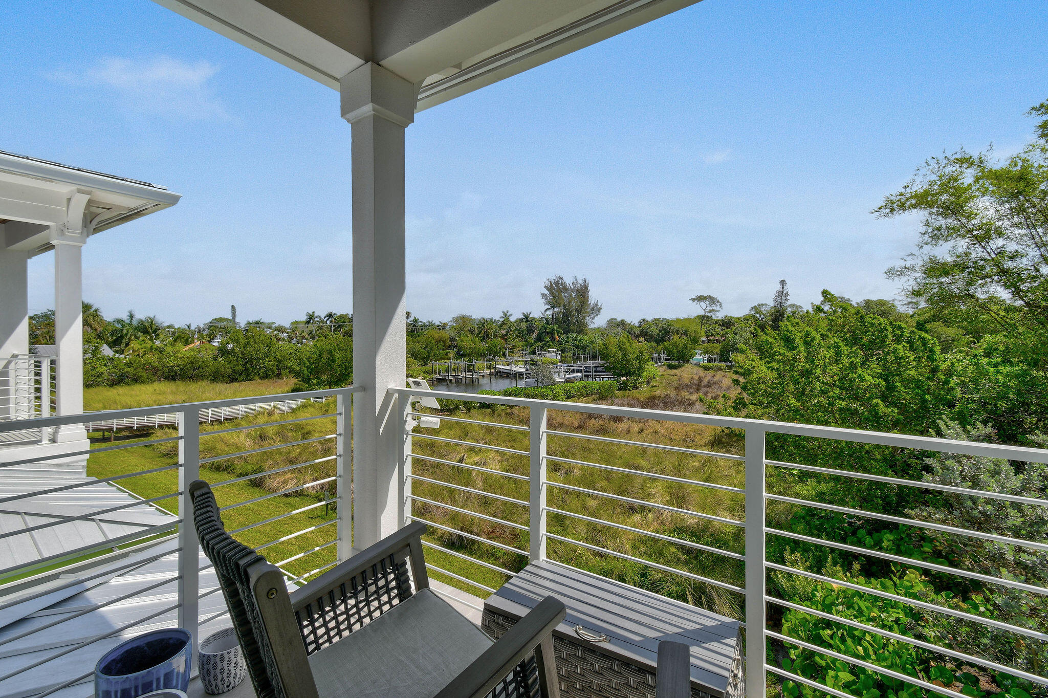 4707 Southeast Manatee Terrace Stuart, FL 34997 - Photo 29 of 68 a view of a balcony with chairs
