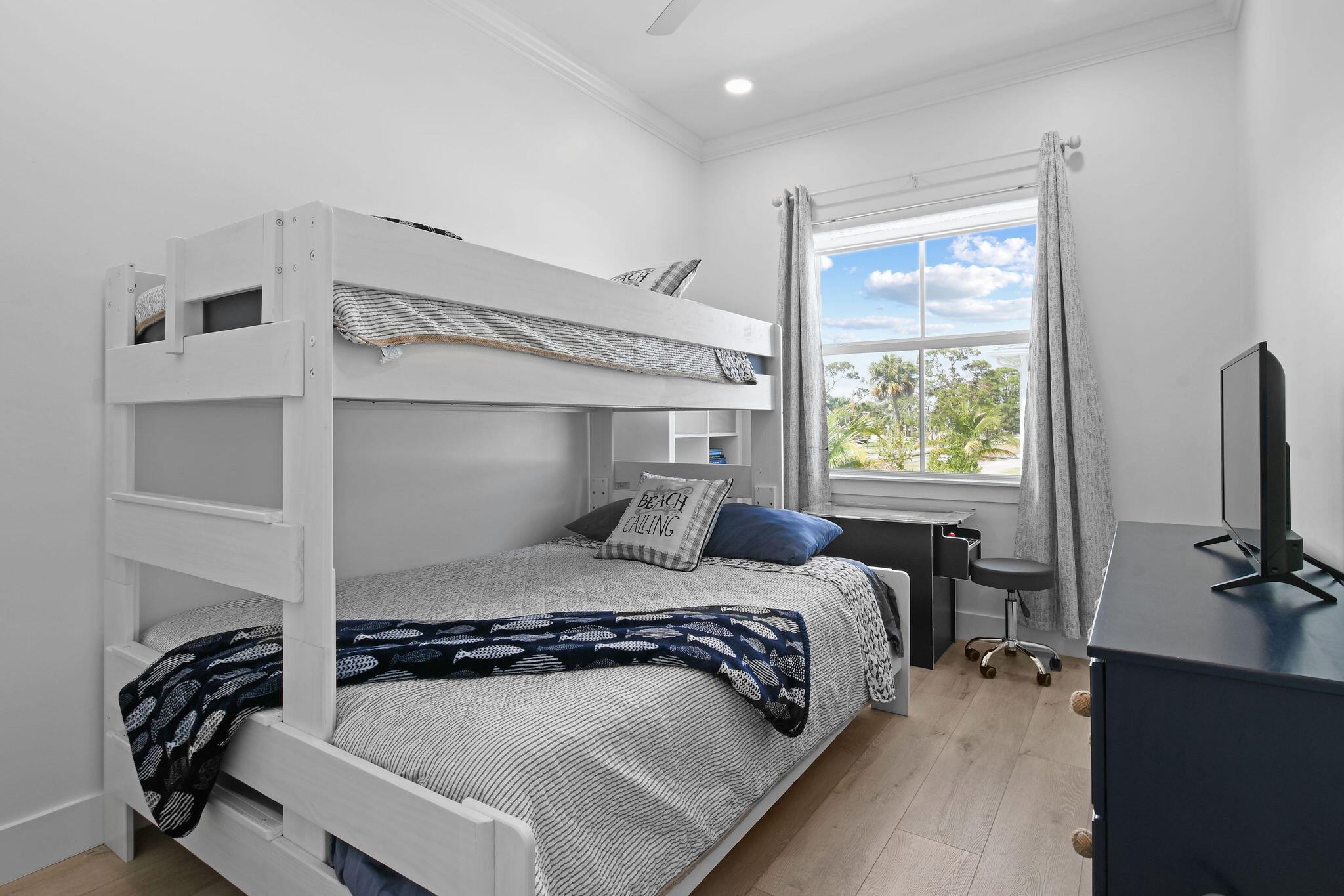 4707 Southeast Manatee Terrace Stuart, FL 34997 - Photo 34 of 68 a bedroom with a bed and a window