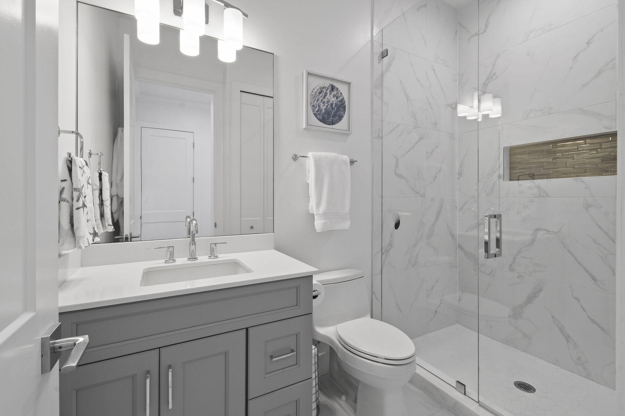 4707 Southeast Manatee Terrace Stuart, FL 34997 - Photo 37 of 68 a bathroom with a sink a toilet and shower