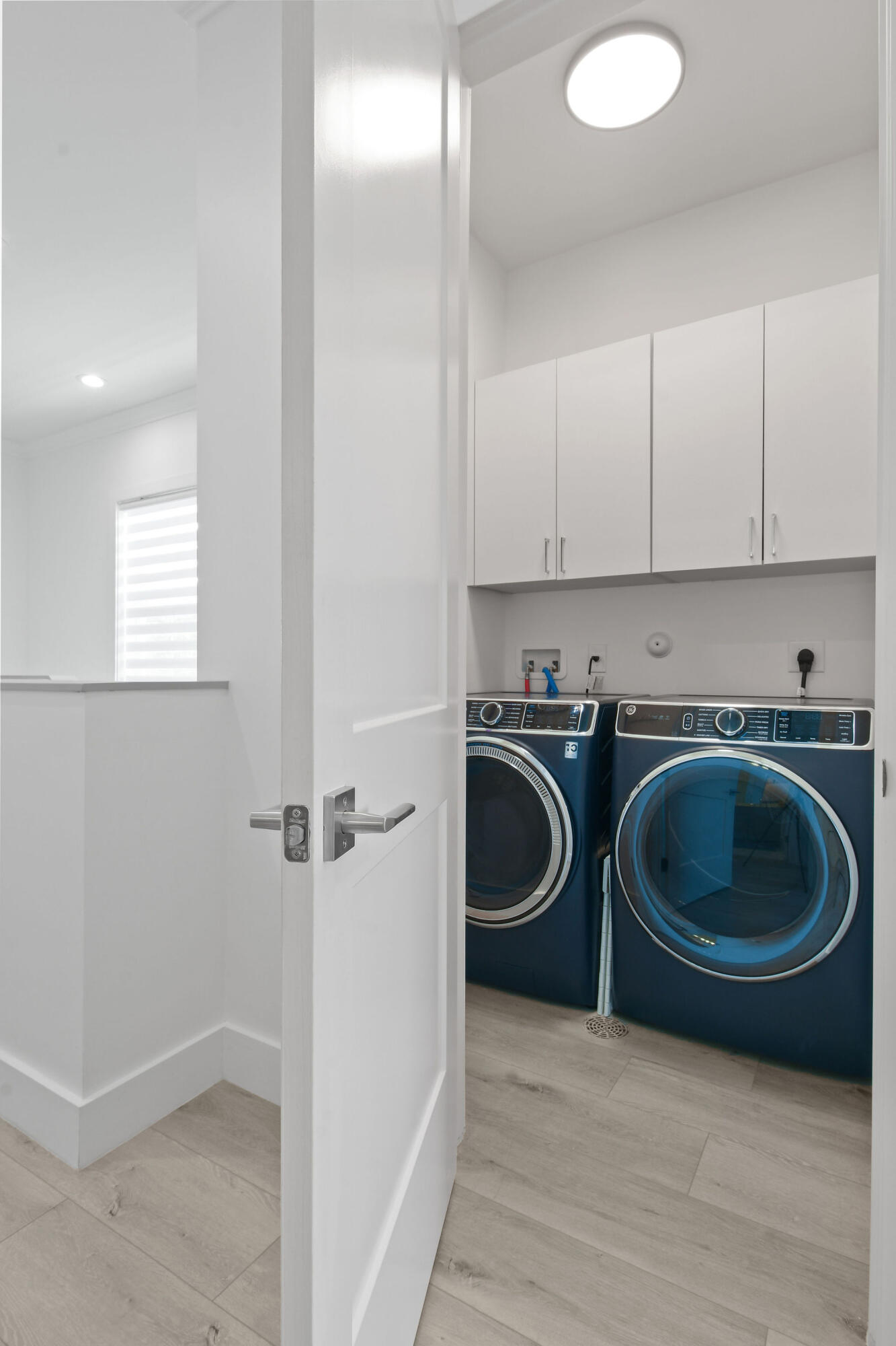 4707 Southeast Manatee Terrace Stuart, FL 34997 - Photo 42 of 68 a utility room with sink washer and dryer