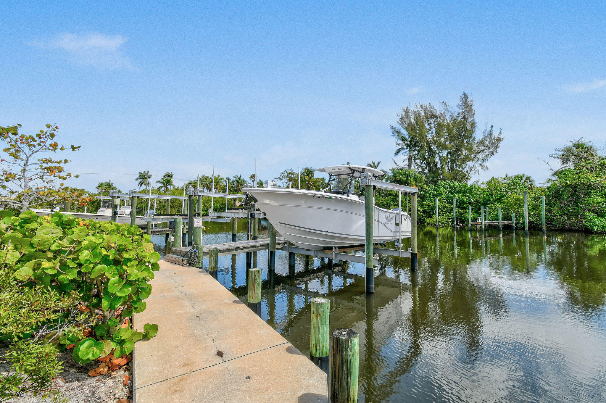 4707 Southeast Manatee Terrace Stuart, FL 34997 - Photo 49 of 68 a view of a lake with a city from a terrace
