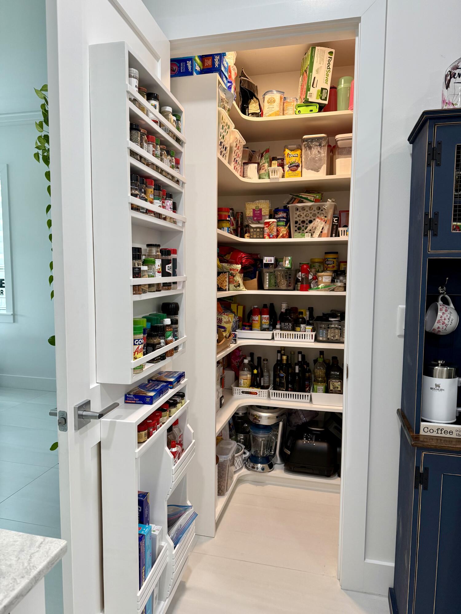 4707 Southeast Manatee Terrace Stuart, FL 34997 - Photo 60 of 68 a view of walk in closet with clothes and shoes
