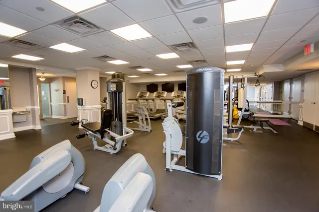 a view of a swimming pool and outdoor seating