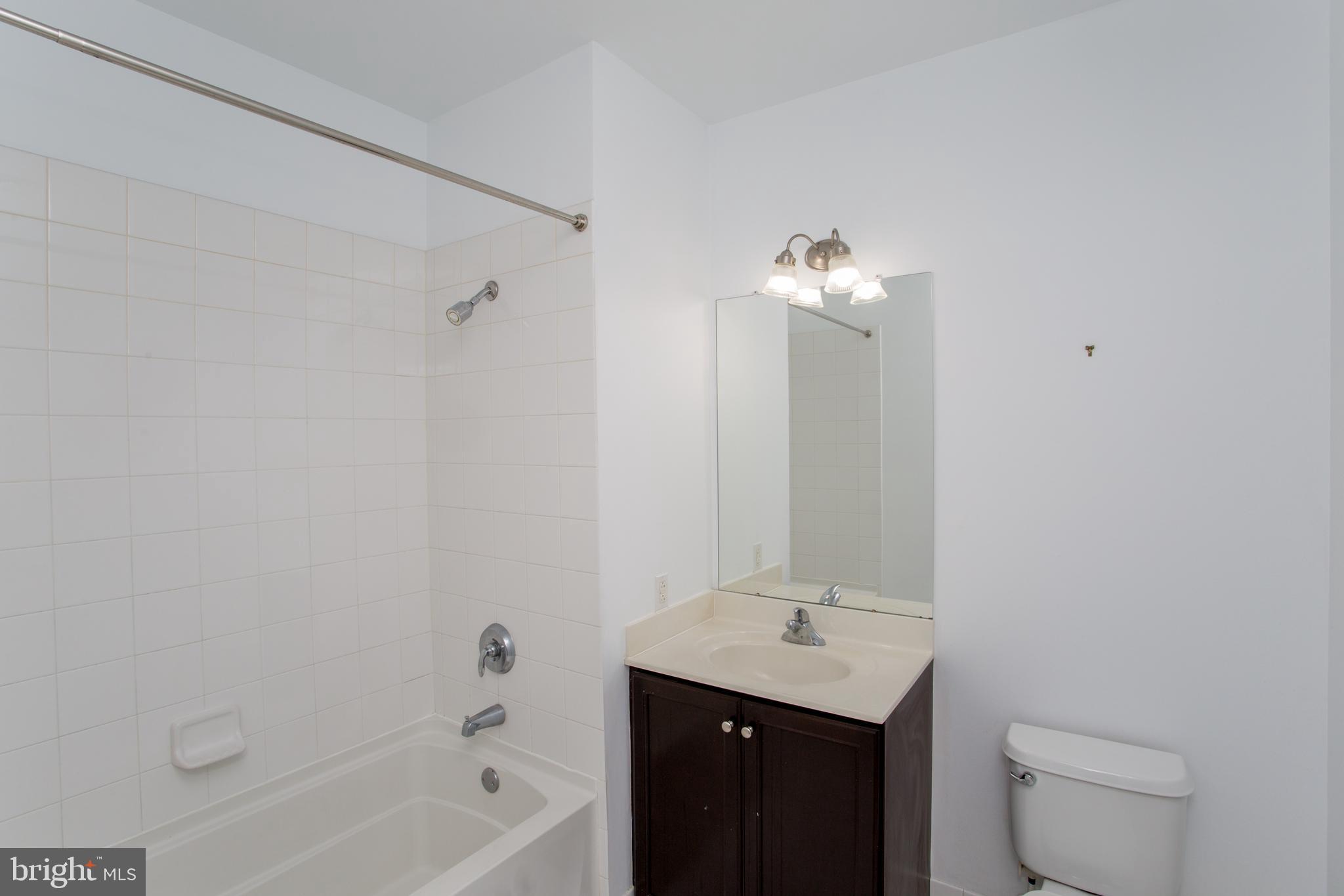523 Carson Terrace Huntingdon Valley, PA 19006 - Photo 19 of 55 a bathroom with a bath tub sink mirror and vanity