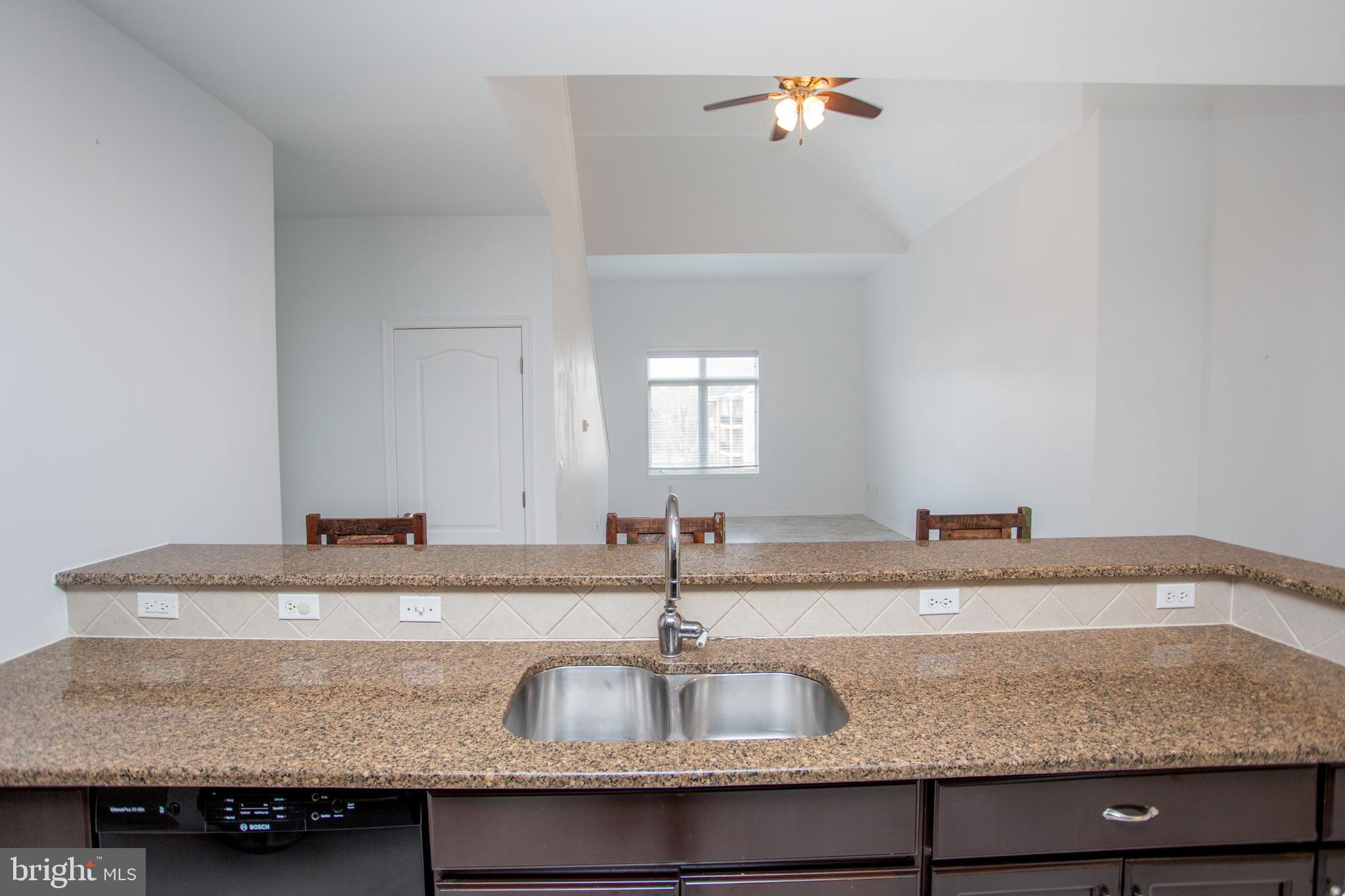 523 Carson Terrace Huntingdon Valley, PA 19006 - Photo 37 of 55 a kitchen with granite countertop a sink a counter top space and cabinets
