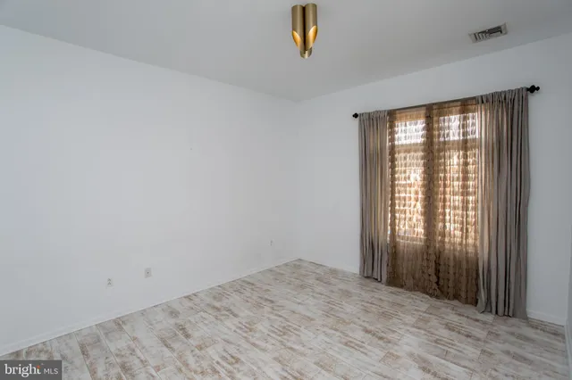a bathroom with a shower and toilet