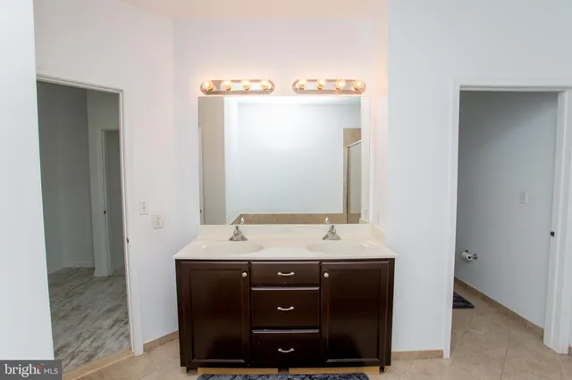 a view of an empty room and wooden floor