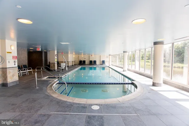 a front view of a building and car parked