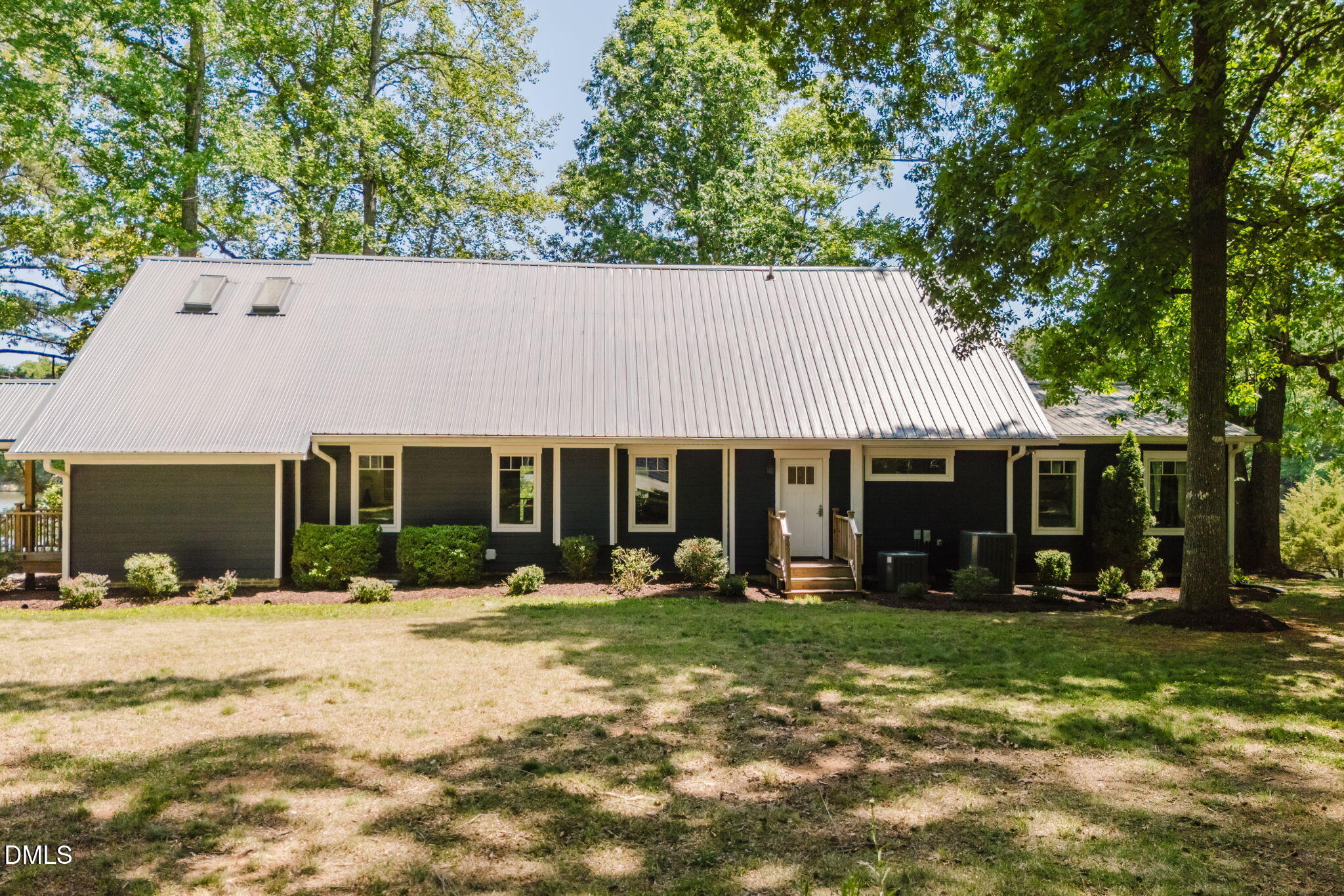 370 Robinson Ferry Road Macon, NC 27551 - Photo 5 of 85 front view of a house with a yard