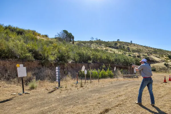 a view of a large mountain with mountains in the background