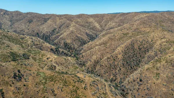 a view of mountains and valleys