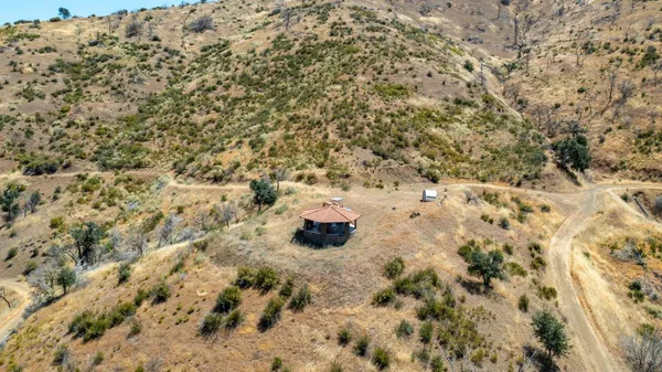 a view of a mountain range with trees in the background