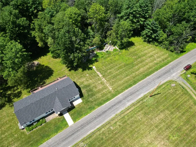 a view of a yard with an outdoor seating