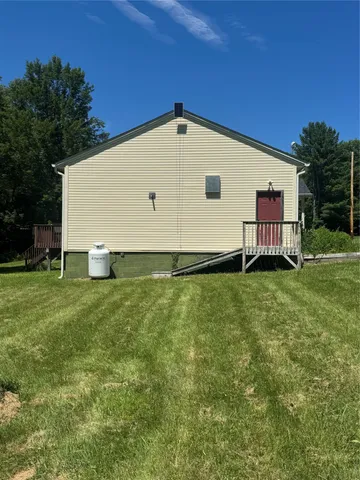 a view of a backyard with a garden
