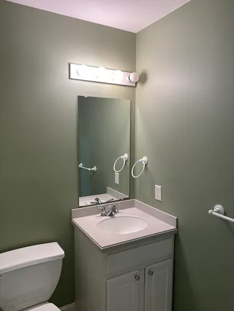 a bathroom with a sink and mirror